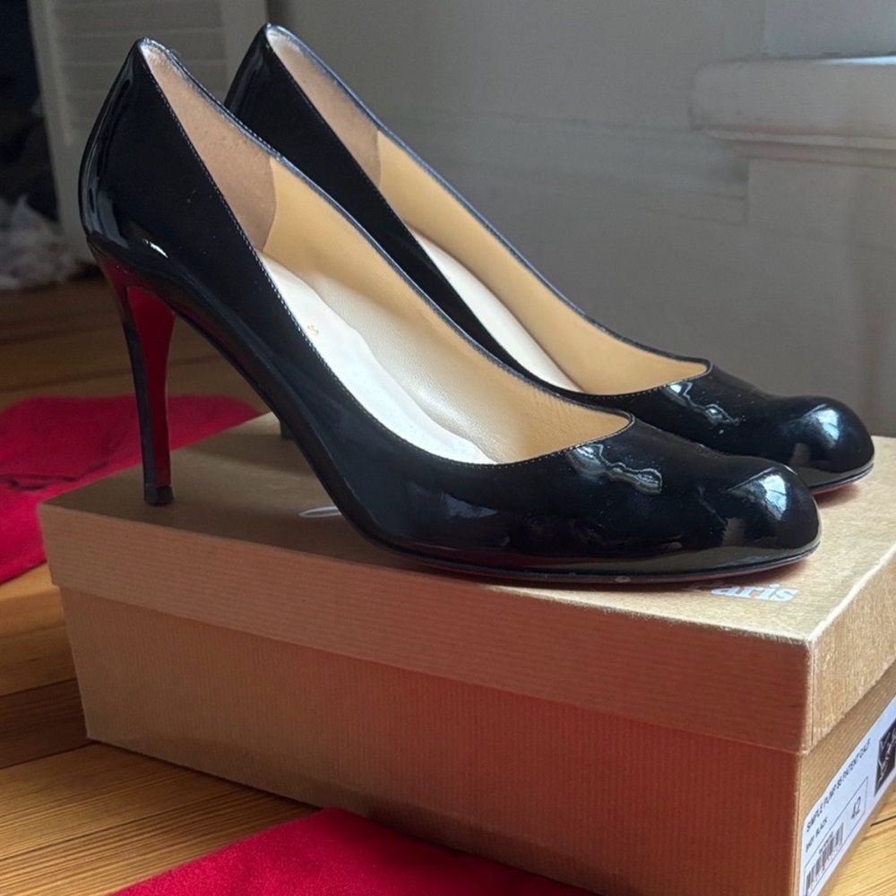 Iconic Glossy Black Louboutin heels barely worn